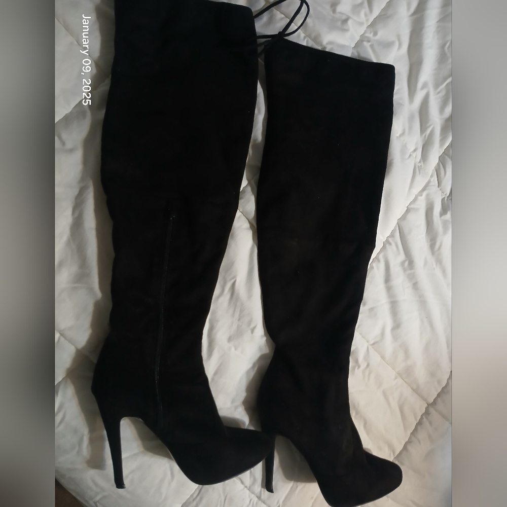 Womens over the knee 4 inch heel black boots.